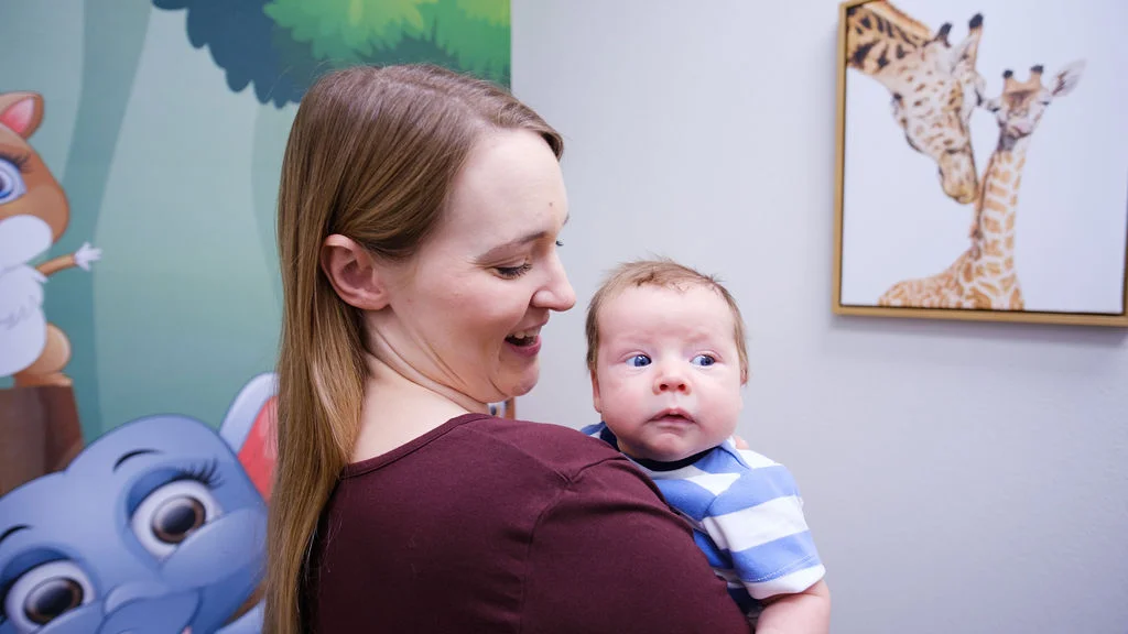mom-with-baby-first-visit-aviator-pediatric-children's-dentistry-Watauga-TX